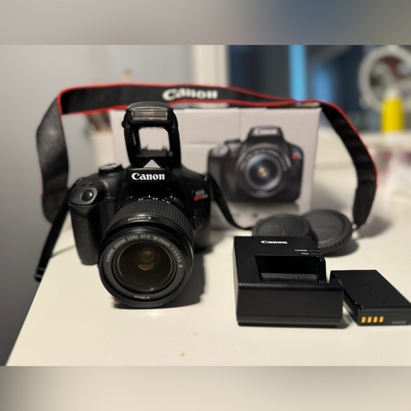Canon EOS Rebel T100 Digital SLR Camera with 18-55mm Lens...